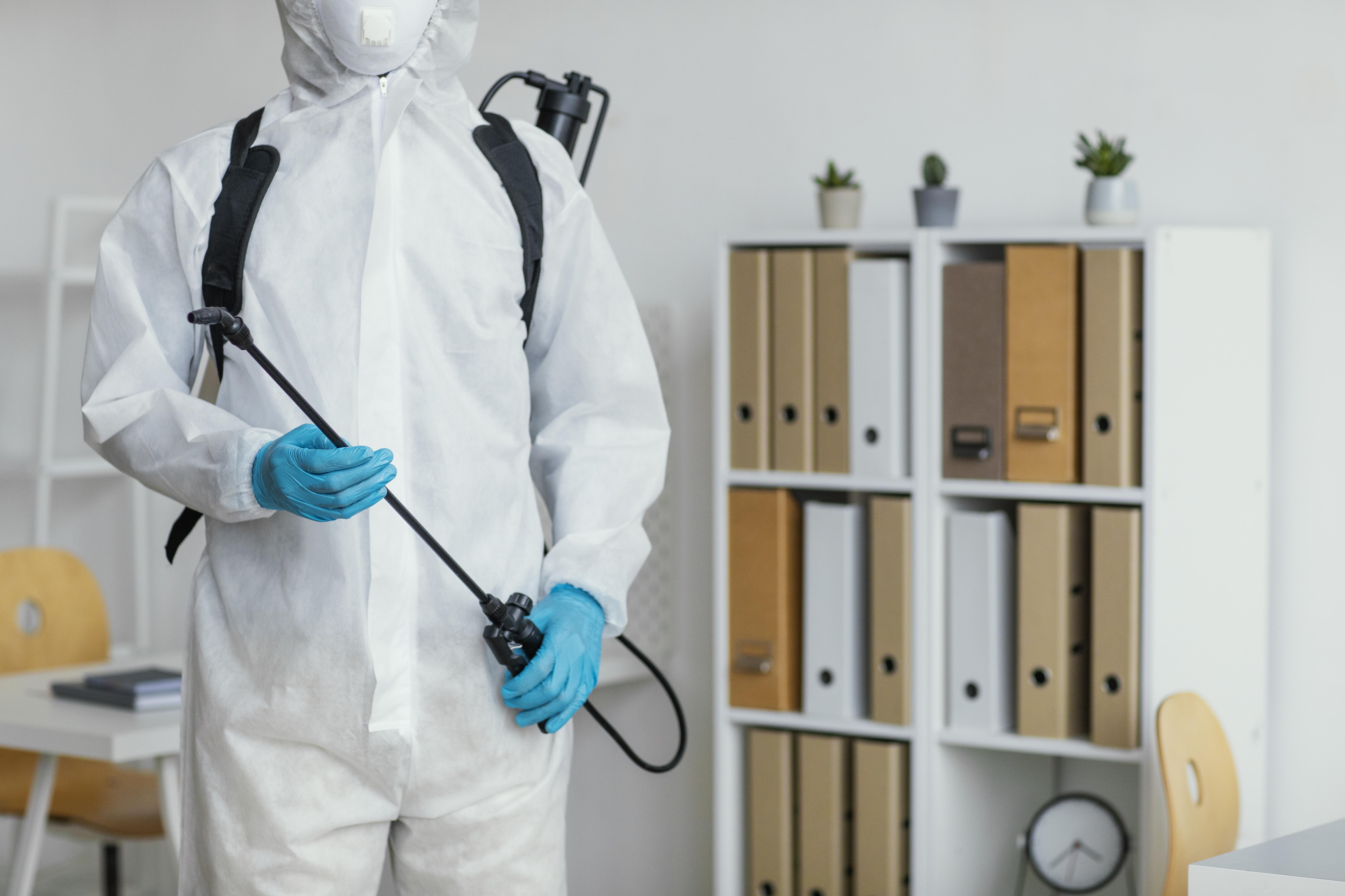 person-protective-suit-getting-ready-disinfect-room